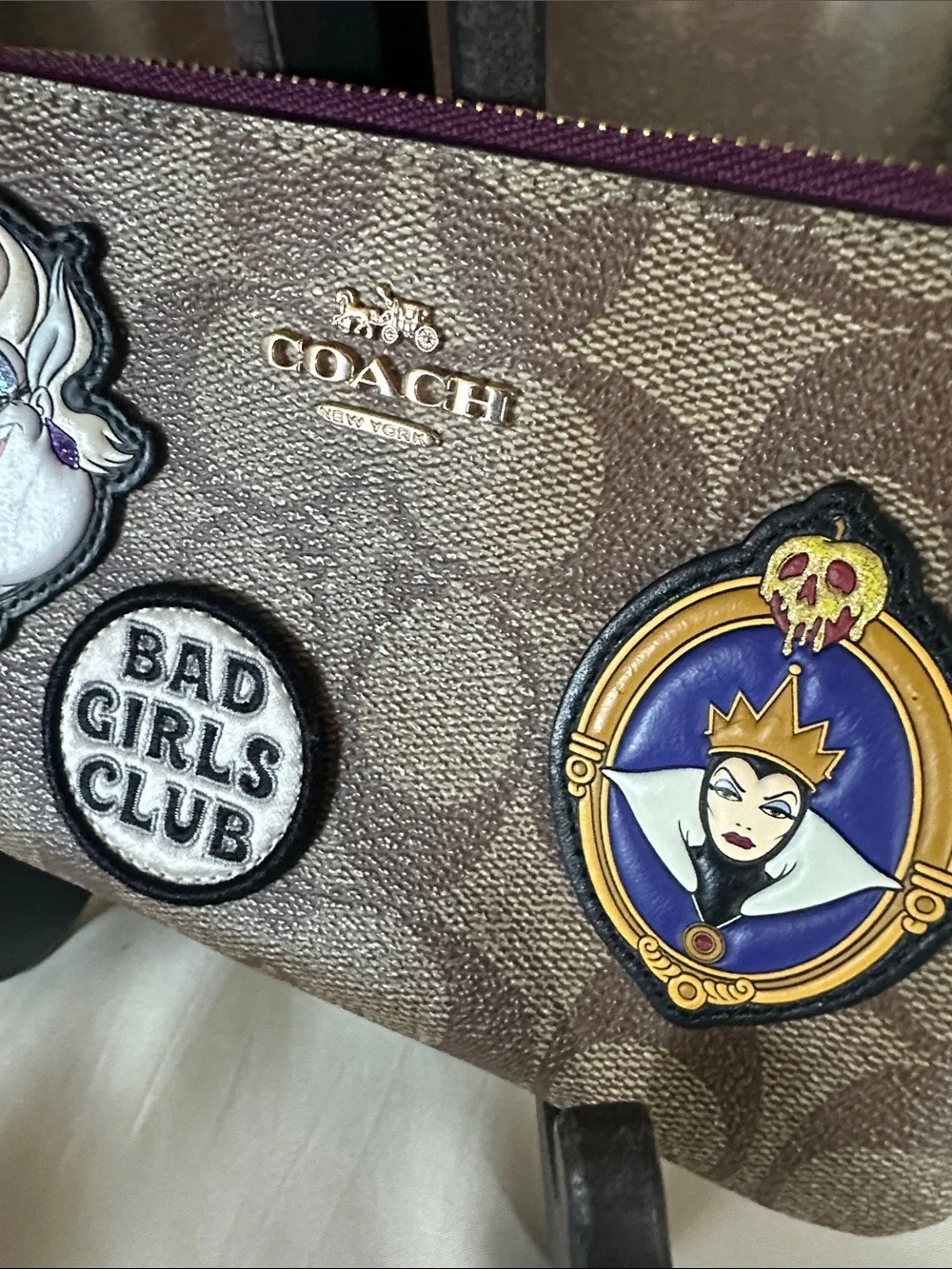 Coach Canvas Disney “Bad Girls Club”Wristlet in Brown with Purple Trim